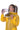 Person wearing a yellow beekeeping suit drinking from a water bottle.